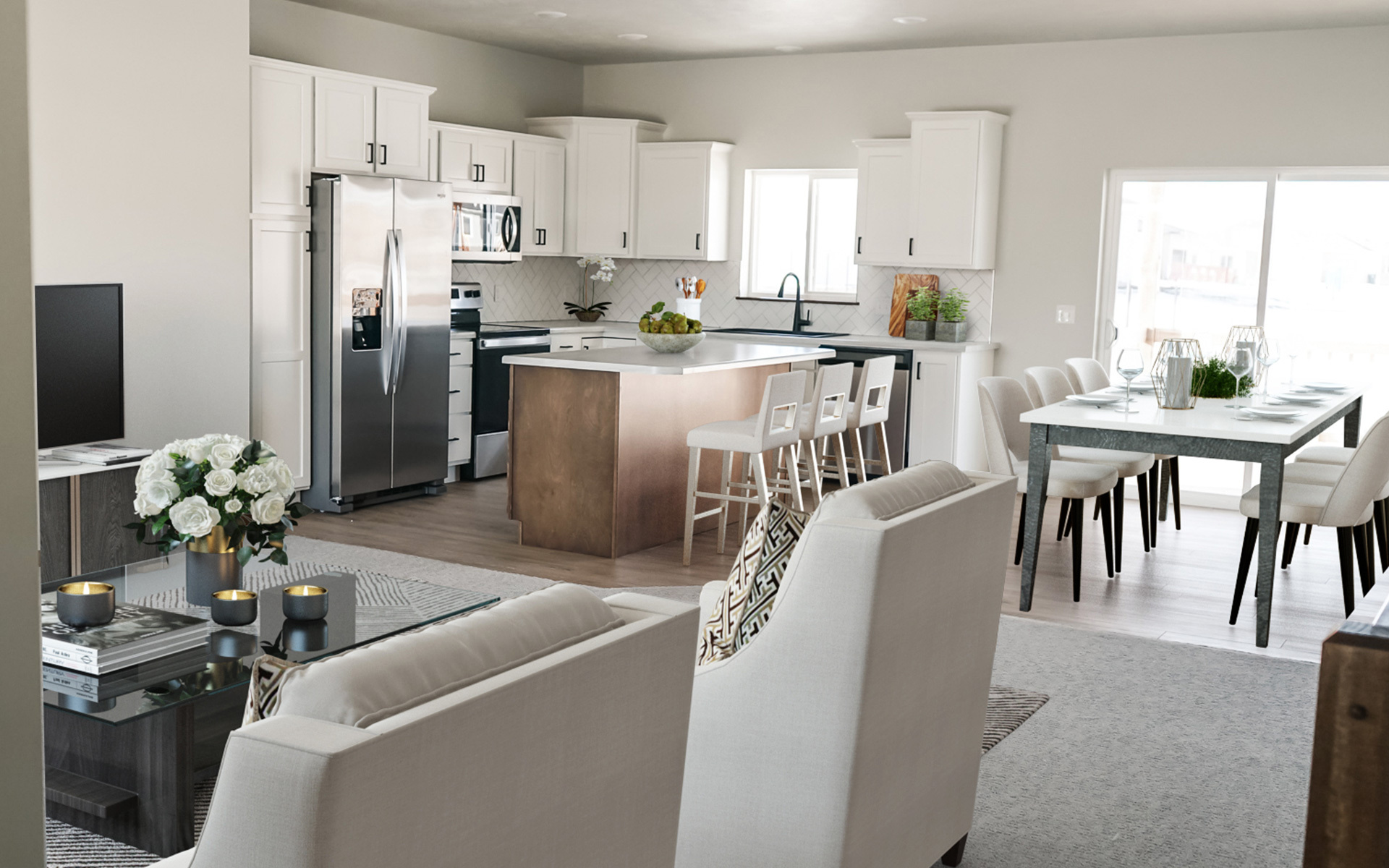An open concept new construction home features a kitchen to dining to living room transition.