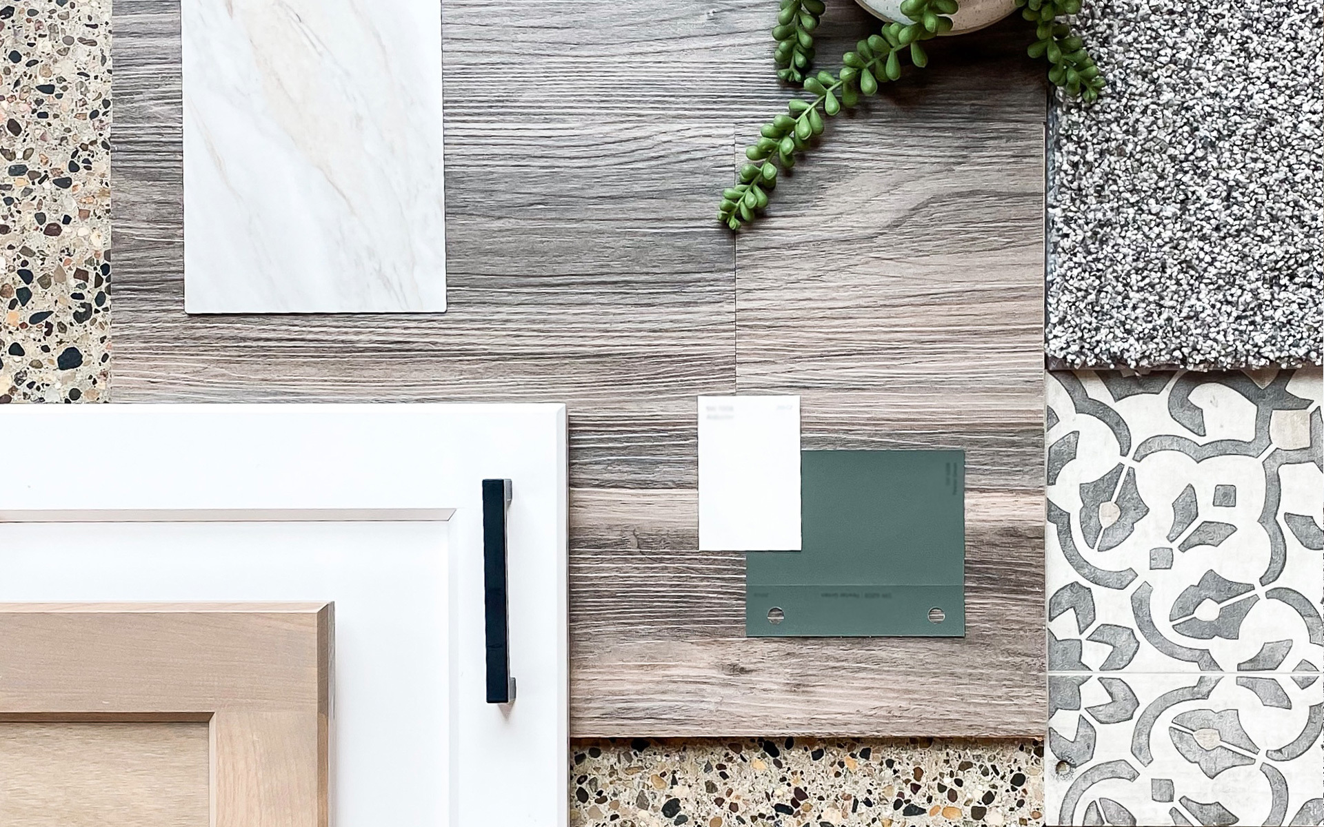 A flat-lay image of home finish details including paint colors, cabinet, and flooring options.