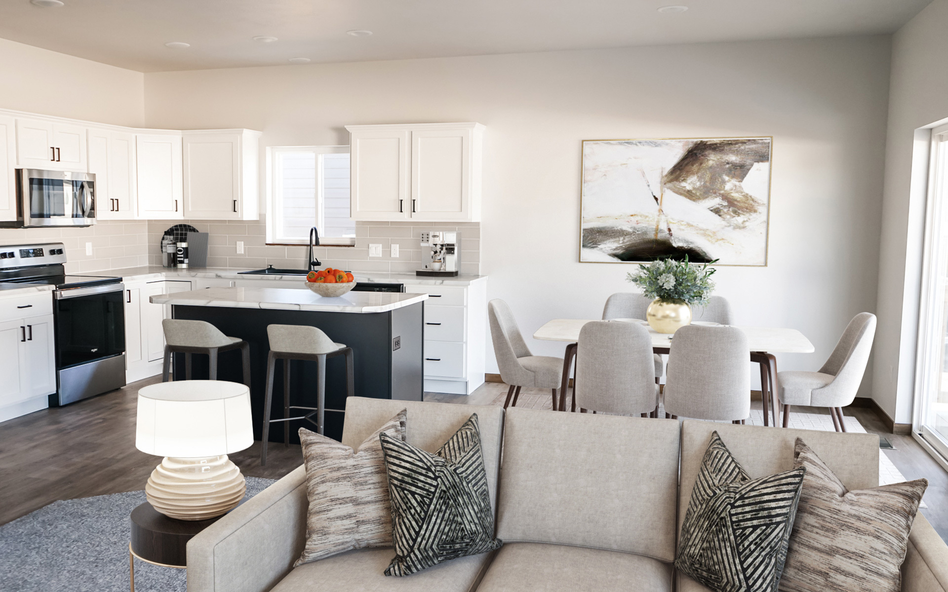 A modern open concept home featuring a kitchen to dining to living room open space.