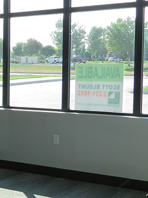 An office space features a for lease sign.