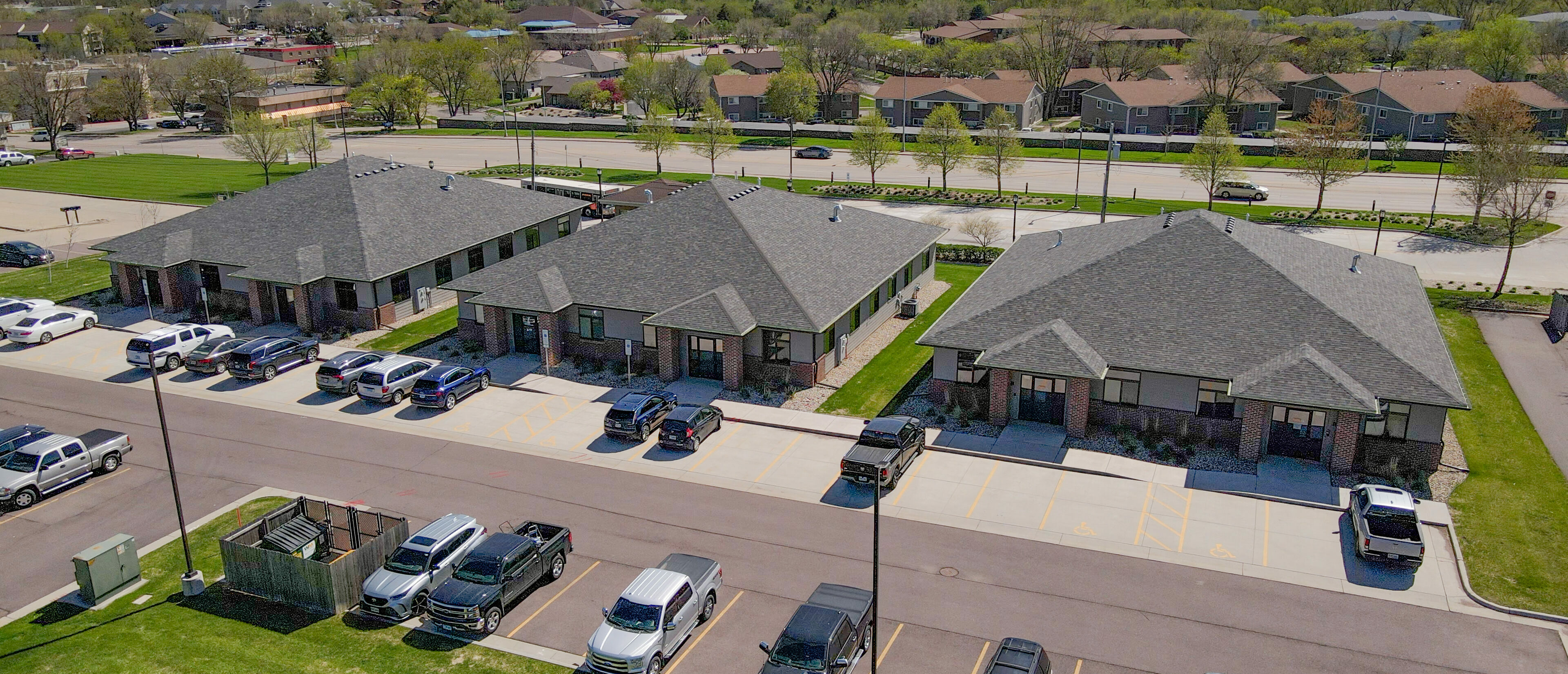 Three brick office buildings